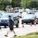 A pedestrian looks to cross Plymouth Rd. between Traverwood Dr. and Nixon Rd. as Ann Arbor police investigate an accident on Wednesday, August 7, 2013. Melanie Maxwell | AnnArbor.com 